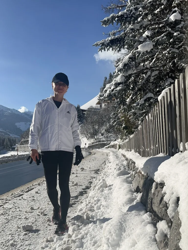 a woman runner wearing winter running gear