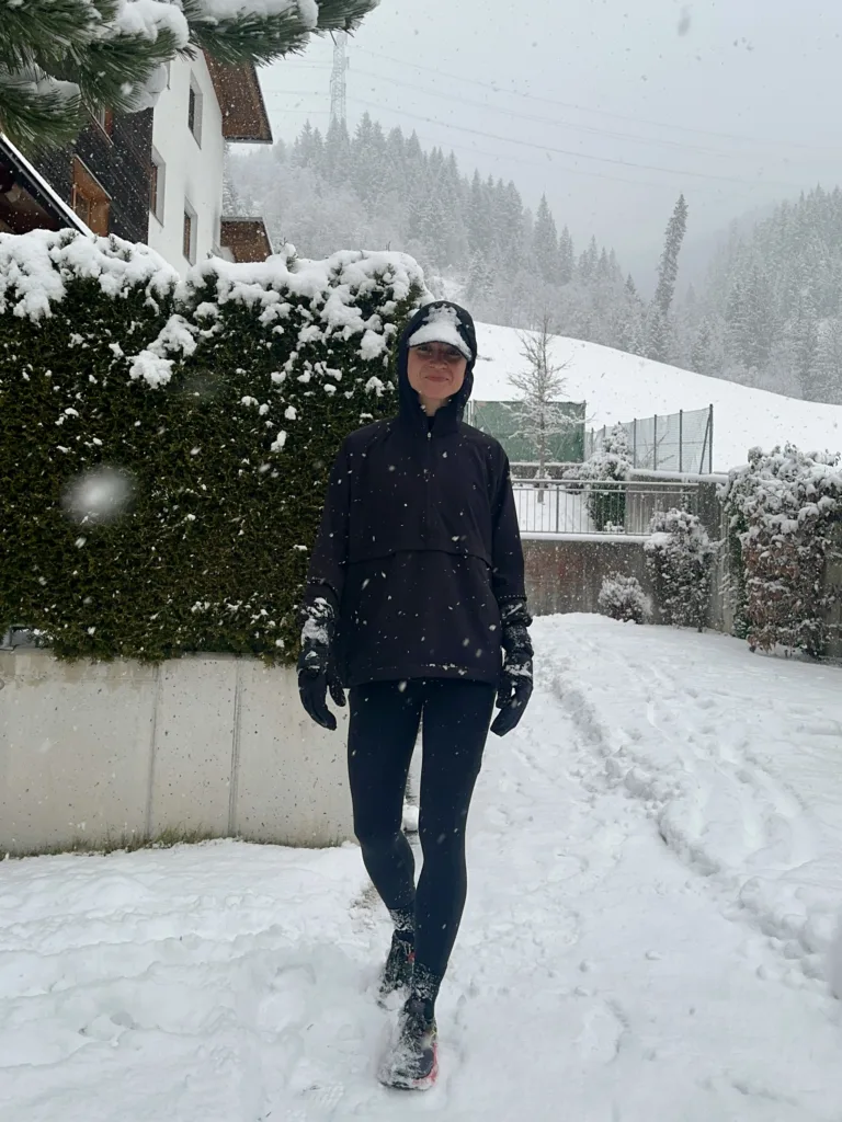 a woman runner wearing winter running gear